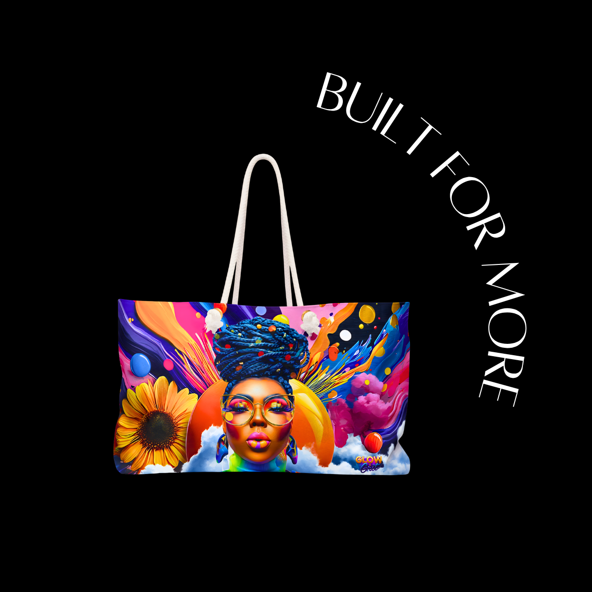 Colorful tote bag with artistic design of a woman's face and text 'BUILT FOR MORE' on a black background.