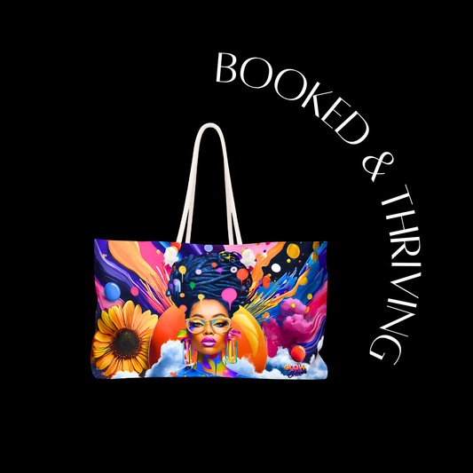Colorful tote bag with artistic design and 'Booked & Thriving' text on a black background